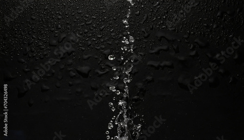 water drops on mat black background