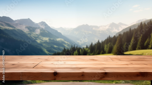 Empty wooden table in front blur alpine meadows background, product display 