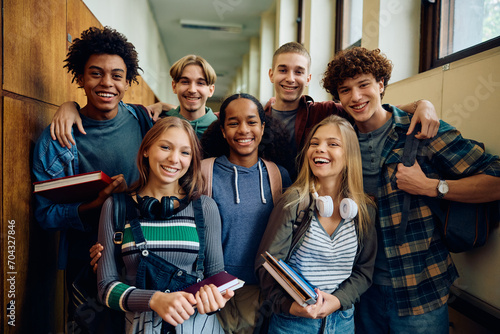 Foto Multiracial group of happy classmates at high school looking at camera