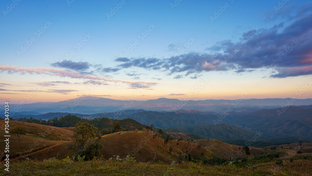 Beautiful panorama scenery of the sea of mist in the morning at Car Camping site with a viewpoint nature of Doi Balu Kho Mountain, Mae Chaem, Chiang Mai, Thailand. Background concept.