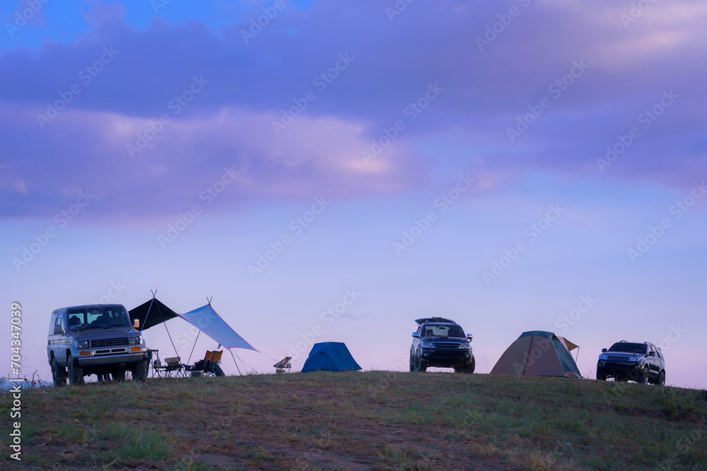 The beautiful natural scenery of happy recreation on the vacation of camp car style in the morning at Camp Car Camping site on the top of a mountain in winter season at Chiang Mai, Thailand.