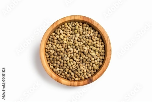 flat lay top view of dried coriander seeds in the wooden bowl isolated on white background. generatif ai