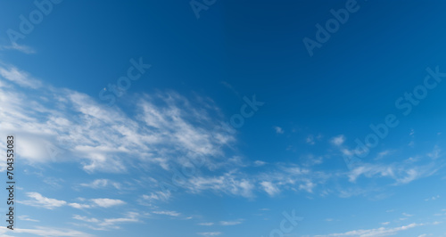 blue sky background with white clouds on a sunny day