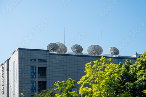 Satellite receiver on top of the building photo