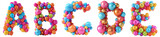 Group of 3d rendering letters A B C D E made of colorful balloons. Funny alphabet isolated on transparent background.