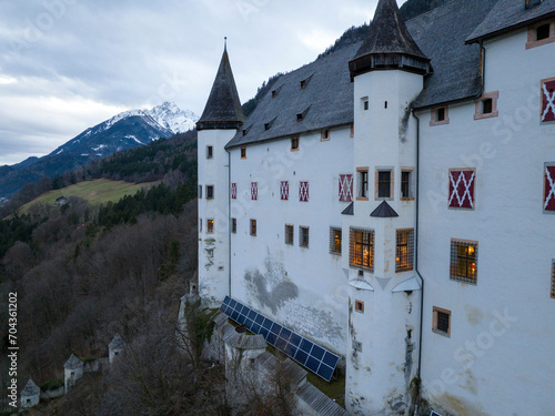 Tratzberg Castle in Tyrol, Austria. Aerial Drone View at winter twilights. White Renaissance Castle with Panorama View photo