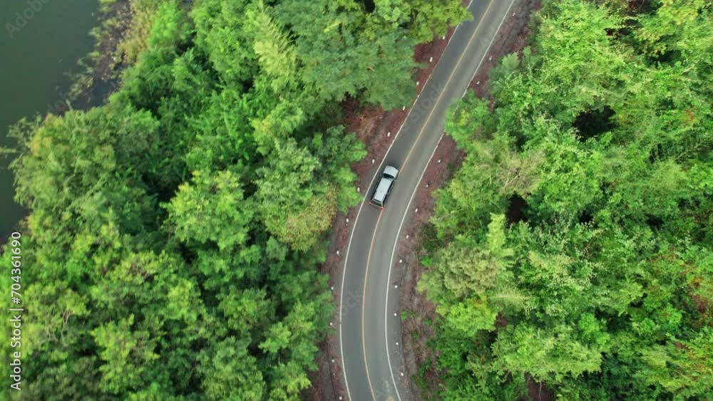Car driving on rural road in the forest, top view tracking Car driving on rural road in the forest, top view tracking