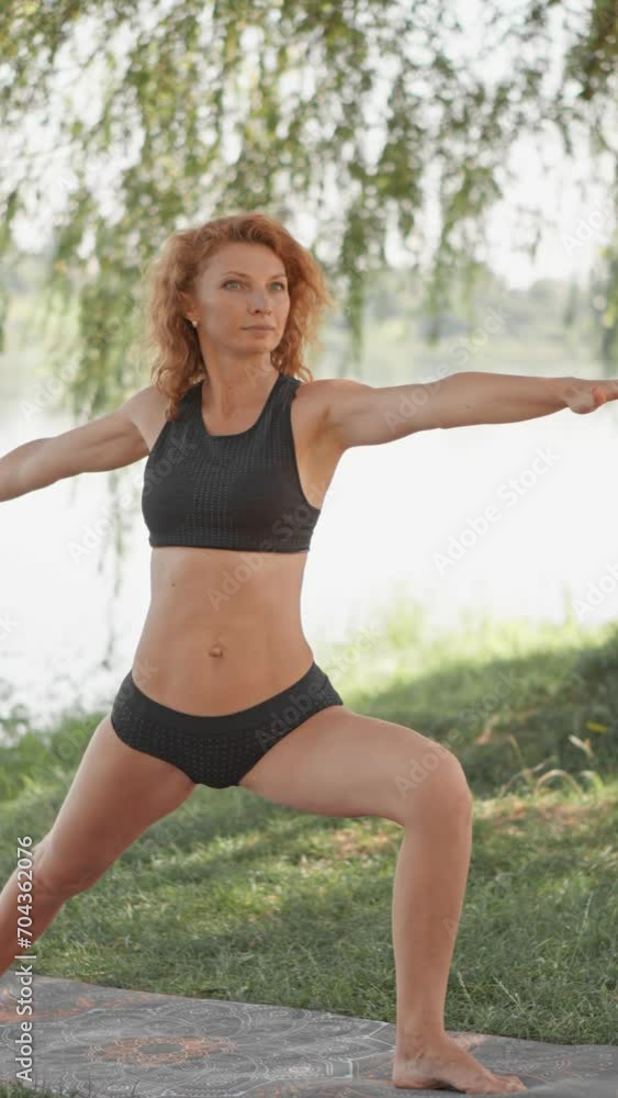 Increasing self perception and self determination through yoga, which promotes deep understanding oneself and improved self esteem. Middle-aged woman working on healthy body, mind. Vertical video. Increasing self perception and self determination through yoga, which promotes deep understanding oneself and improved self esteem. Middle-aged woman working on healthy body, mind. Vertical video.