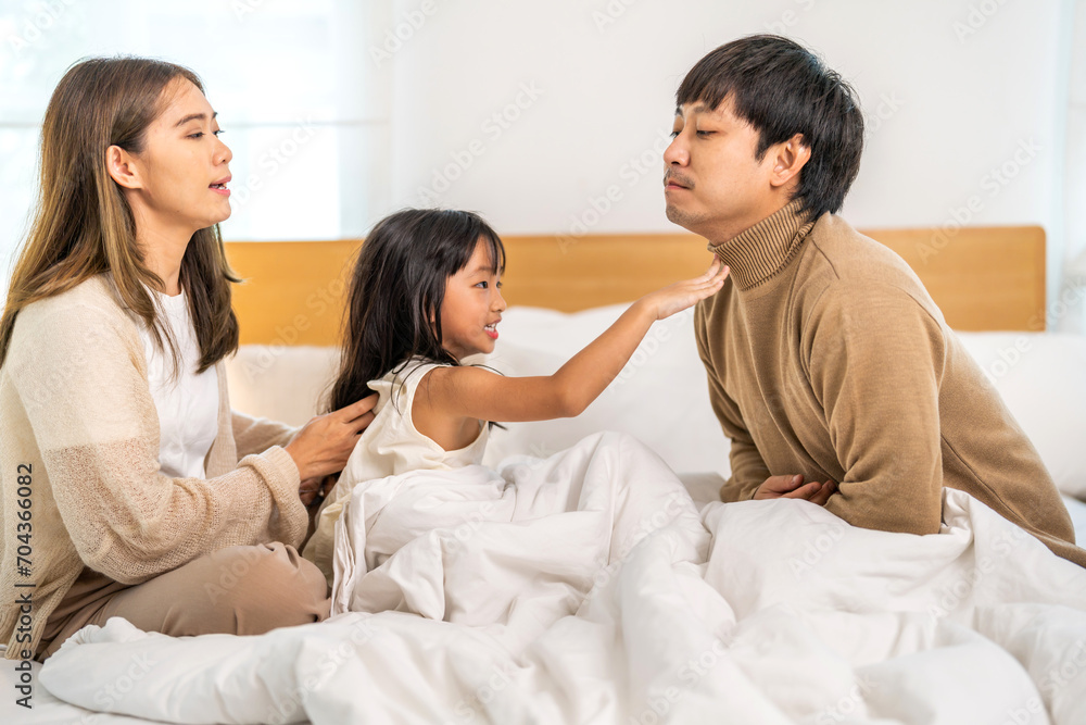 Portrait of enjoy happy love asian family father and mother holding hug cute little asian girl child smiling play and having fun moments good time, care, kid, support, insurance, child, at home Portrait of enjoy happy love asian family father and mother holding hug cute little asian girl child smiling play and having fun moments good time, care, kid, support, insurance, child, at home