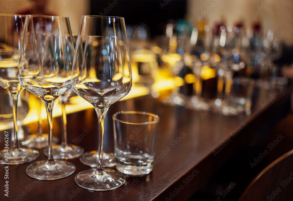 Glass goblets placed in rows on table during wine tasting procedure in restaurant Glass goblets placed in rows on table during wine tasting procedure in restaurant