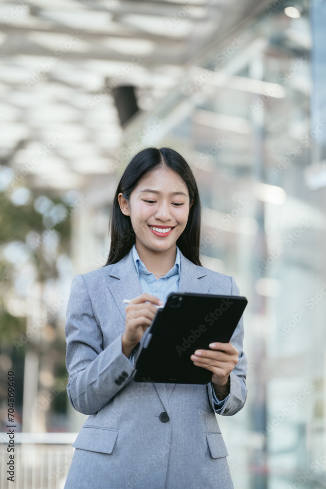 Business woman reading stats and graphs on paperwork with Tablet. Business woman reading stats and graphs on paperwork with Tablet.