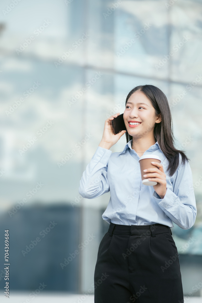 Businesswoman walking and talking phones on street in city Outside Office with drinking coffee. Businesswoman walking and talking phones on street in city Outside Office with drinking coffee.