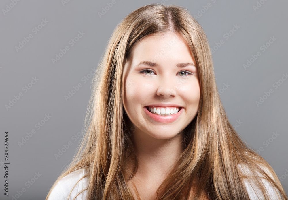 Fototapeta premium Portrait of a young smiling girl