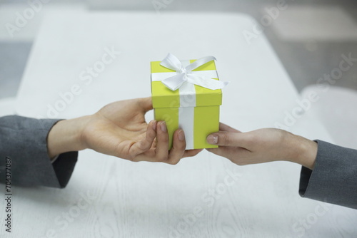 Cropped Hands Of Couple Holding Gift Box