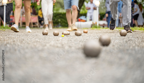 Bocce players collect metal boules on court petanque french outdoor game  photo