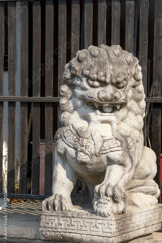Chinese imperial guardian lion in front of temple