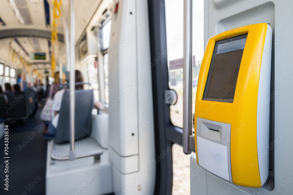 Selective focus on modern ticket validator with empty screen in city public transport. Selective focus on modern ticket validator with empty screen in city public transport.