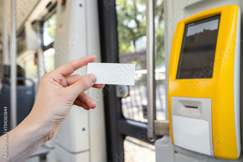 Foto Selective focus on woman hand with blank paper ticket inside intercity train