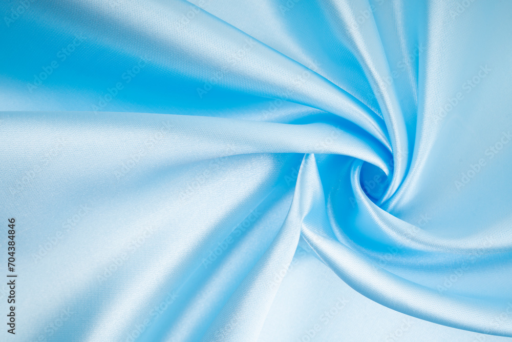 Fototapeta premium Close-up shot of luxury light blue satin.