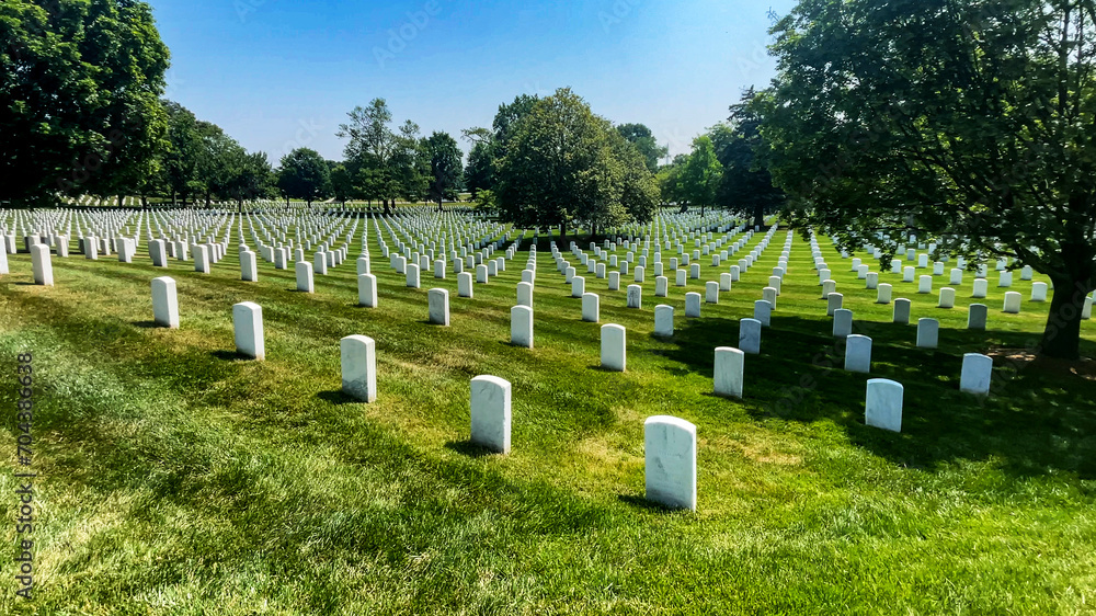 Huge rows of tombs with white marble tombstones at Arlington National Military Cemetery in Washington DC, the capital of the USA. Huge rows of tombs with white marble tombstones at Arlington National Military Cemetery in Washington DC, the capital of the USA.