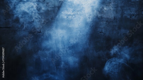 Photo dark blue wall with decorative stucco. smoke, smog, spotlight