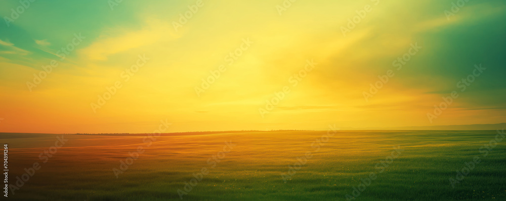 Teal, blue, green and yellow Fantasy vibrant panoramic sunset sky - Gradient rich colors - ethereal dreamy summer sunset or sunrise sky. Uplifting and peaceful sky. Grass field