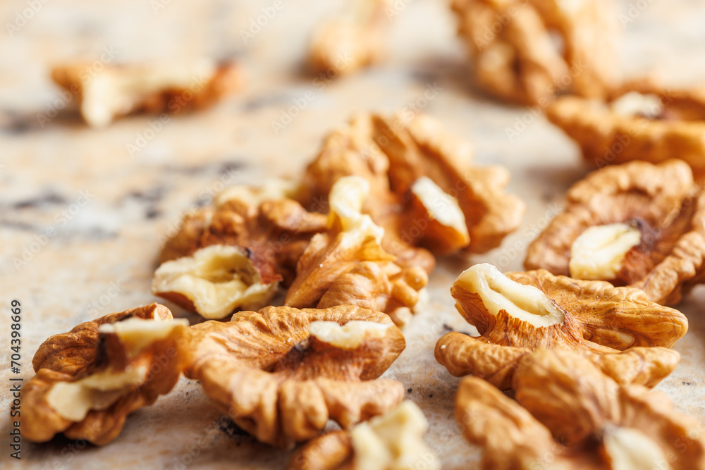 Peeled dried walnut kernels on kitchen table. Peeled dried walnut kernels on kitchen table.
