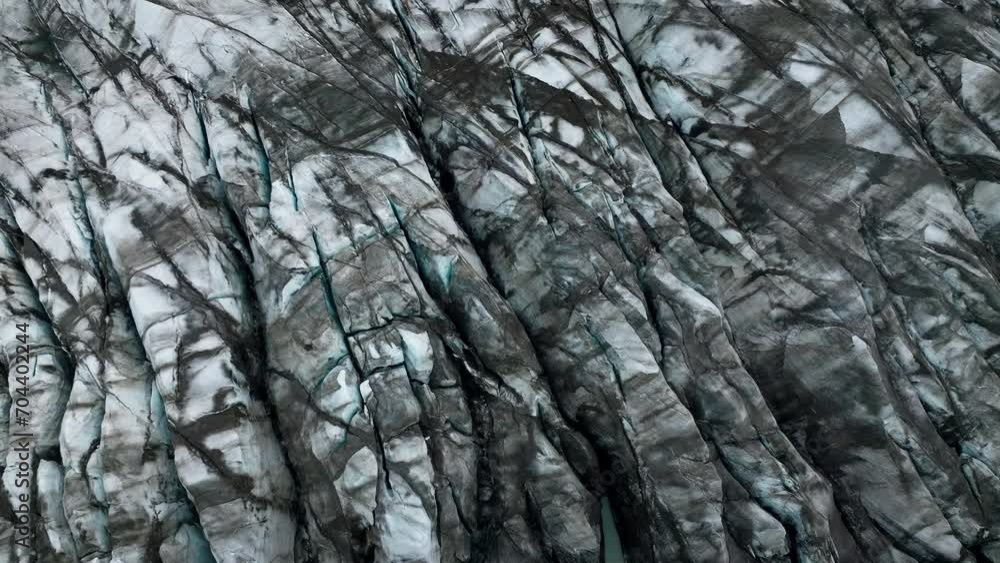 Dark gray volcanic rock formation formed from cooled lava, aerial top down shot. Nature background, texture, and pattern concepts. Dark gray volcanic rock formation formed from cooled lava, aerial top down shot. Nature background, texture, and pattern concepts.