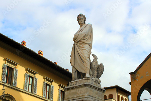 Florence. Italy. March 11, 2019. Monument to famous Dante Alighieri - Italian poet, thinker, theologian, one of founders of literary Italian language, politician. Sculpture on square with an eagle.