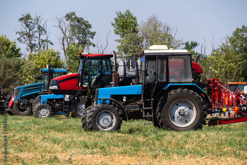 Agricultural tractors on a field Agricultural tractors on a field