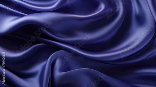 A rich blue satin cloth with a dynamic, flowing texture and a subtle sheen, conveying elegance and luxury.