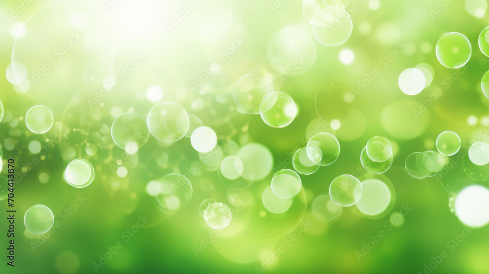Fototapeta premium A beautiful abstract background of green bubbles and bokeh, giving a sense of freshness and natural beauty.