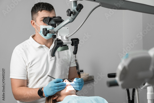 A meticulous and highly qualified dentist carefully examines each patient's tooth under a microscope, identifying and solving any dental problems with incredible accuracy.