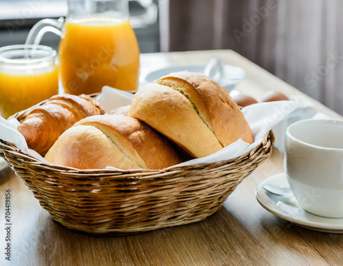 Frühstückstisch mit frischen Brot,Kaffee und o-saft photo