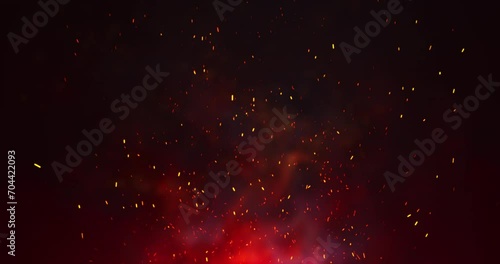 Orange sparks of an abstract campfire flying upwards. The red glow and the bluish smoke of the fire. Seamless looping animation. photo