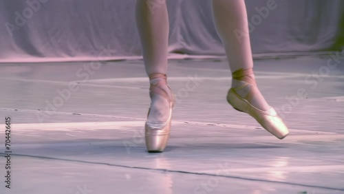 Wallpaper Mural Ballerina Legs on Tiptoes. Close-up of a dancer's legs in pointe shoes gracefully moving across the stage. Slow Motion at a rate of 240 fps.  Torontodigital.ca