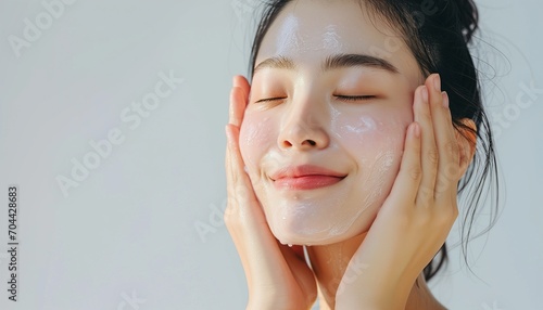 portrait of a woman cleaning her face photo
