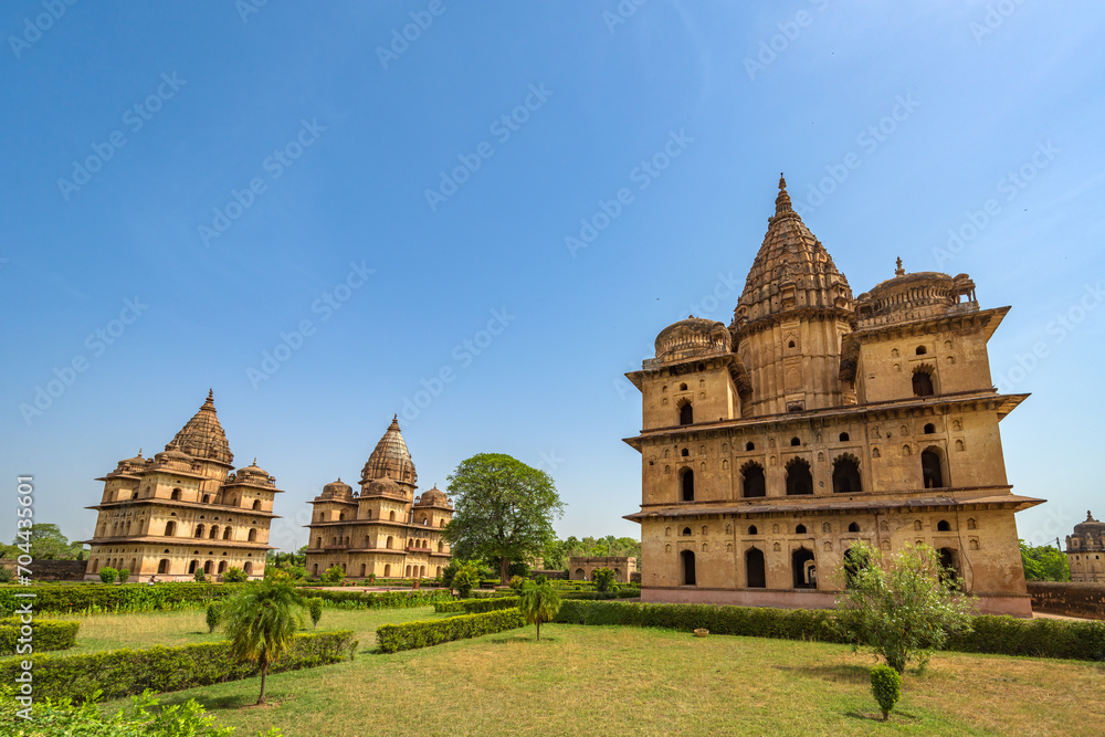 Fototapeta premium Orchha, India - 02 June 2022 - Royal Chhatris or Cenotaphs are the historical monuments situated on the banks of River Betwa in Orchha, Madhya Pradesh, India.