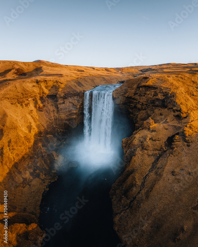 Iceland. Aerial view on the Skogafoss waterfall. Landscape in the Iceland from air. Famous place in Iceland. Landscape from drone. Travel concept. Sunset and sunrise. Soft light. © Mathias