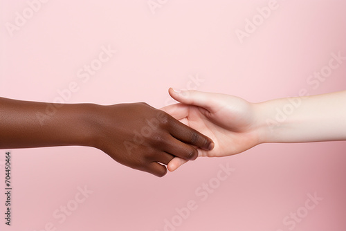 the hands of an African American and a European touch each other. themes relationships  diversity race