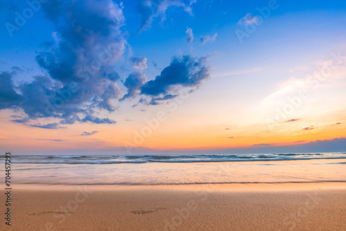 Calm seascape with a beautiful sunset sky and fluffy clouds. photo