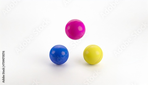 three juggling balls in a studio white background