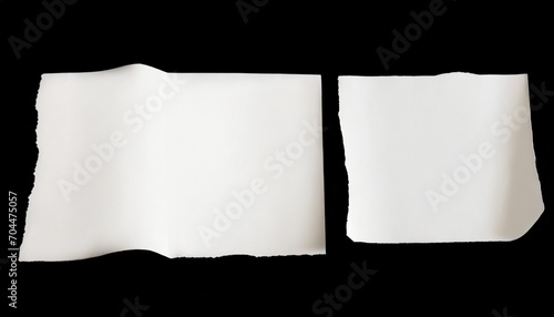 torn sheets of white paper on a black background