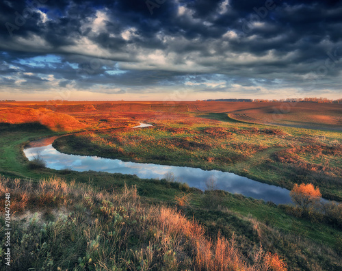 Autumn morning in the picturesque river valley. Autumn landscape with clouds. Nature of Ukraine