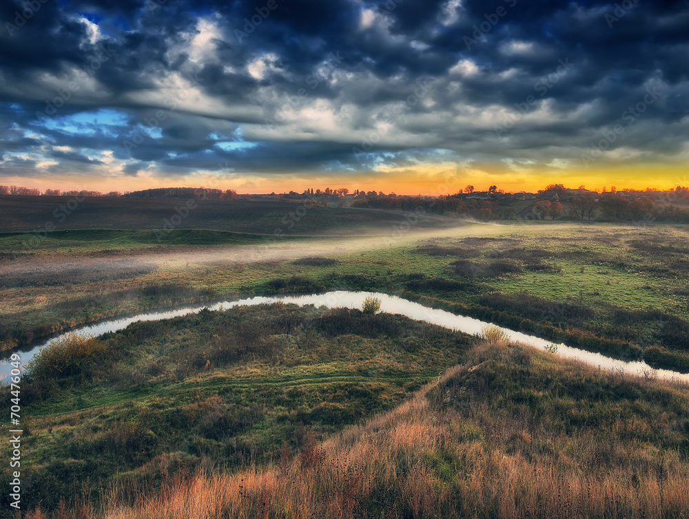 Autumn morning in the picturesque river valley. Autumn landscape with clouds. Nature of Ukraine