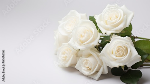 White roses bouquet on white background with soft focus.  © CStock