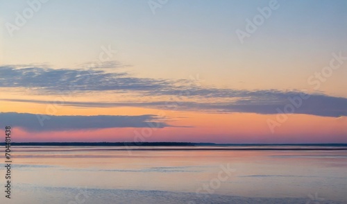 Beautiful sunset with some clouds over the river