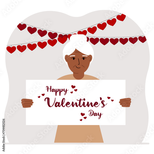 Happy woman holding a poster with text Happy Valentine's Day and red hearts. Love concept. Happy Valentine's Day wallpaper, poster, postcard or congratulation.