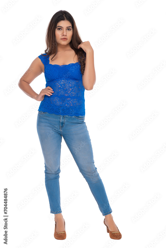 Young Indian girl wearing crochet top and jeans with elegant pose and expression Young Indian girl wearing crochet top and jeans with elegant pose and expression