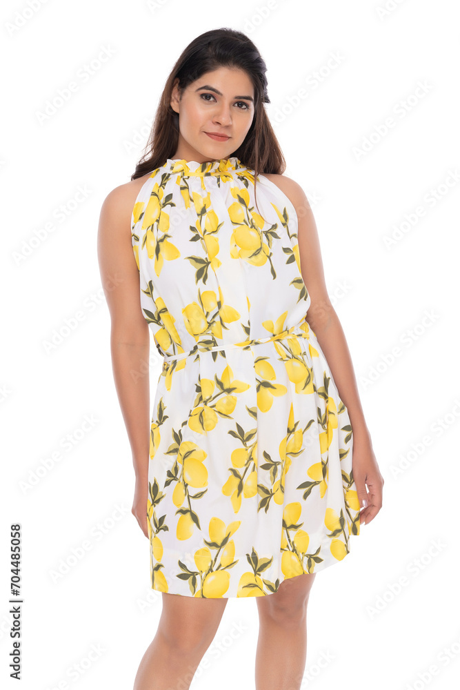 Young Indian girl wearing yellow one piece skirt with elegant pose and expression. Young Indian girl wearing yellow one piece skirt with elegant pose and expression.